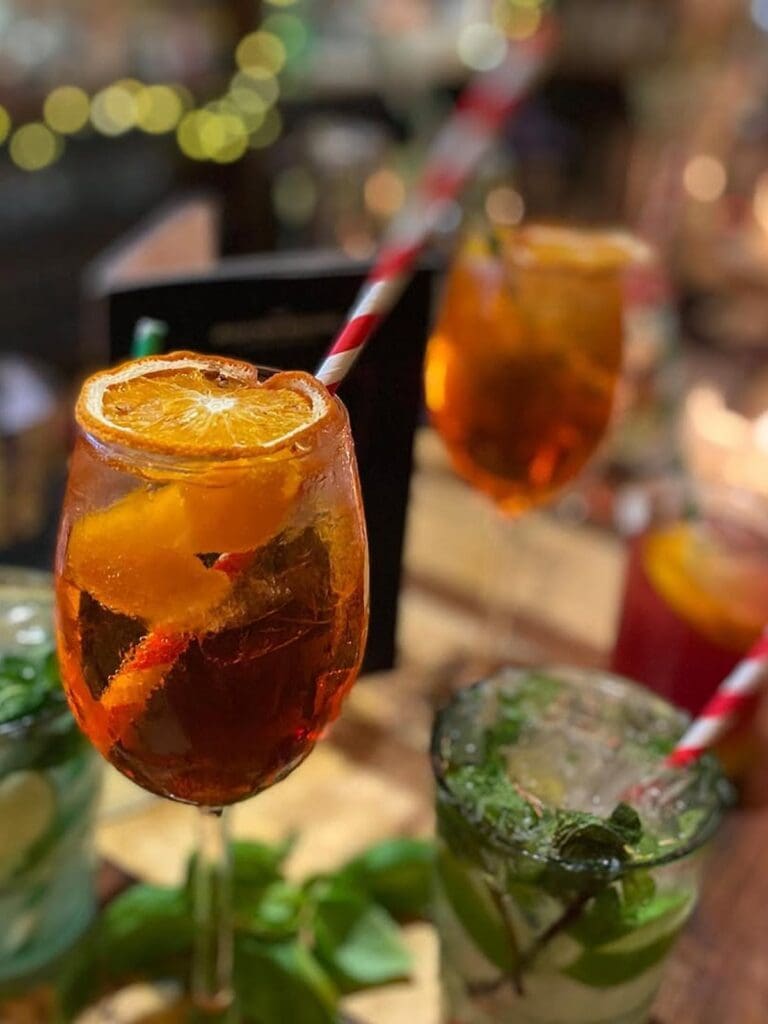 Bright, airy brasserie in an old station setting with live music and boozy brunch drinks for a mixed-group Bath hen weekend.