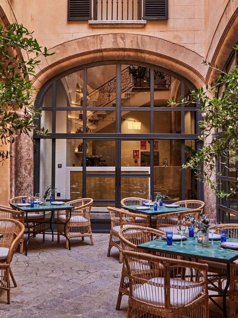 Puro Grand Hotel courtyard in a restored Old Town palace — boutique luxury hideaway for a chic hen weekend in Palma.