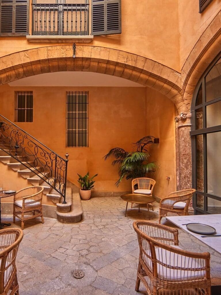 Puro Grand Hotel courtyard in a restored Old Town palace — boutique luxury hideaway for a chic hen weekend in Palma