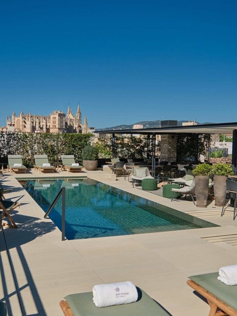 Sant Francesc Hotel Singular rooftop terrace with pool and Palma skyline views — elegant Old Town stay for a luxe hen weekend.