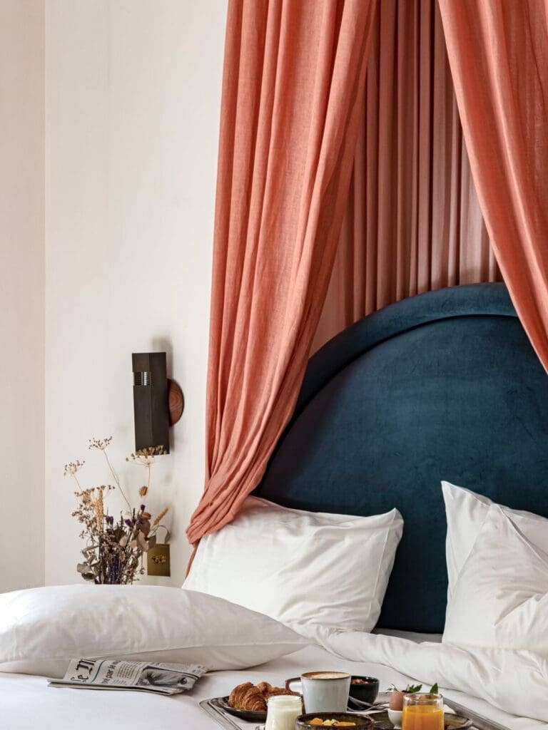 Junior Suite at Hotel des Grands Boulevards, Paris – boutique bedroom with separate lounge space.