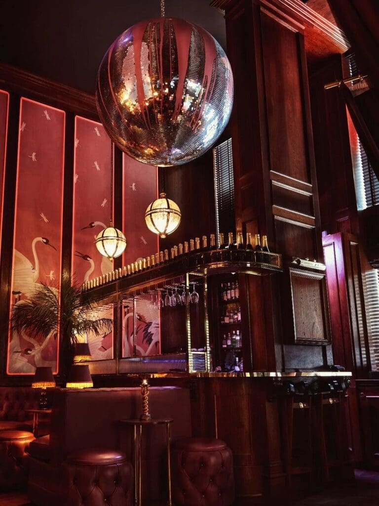 Lilith’s Lounge at House of Gods, dark cocktail bar vibe for pre-dinner drinks on a girls weekend