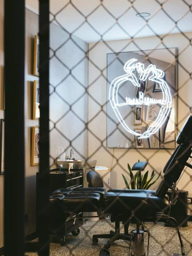 Tattoo studio in the Hotel Hotel basement in Lisbon with terrazzo flooring and curved modern architecture