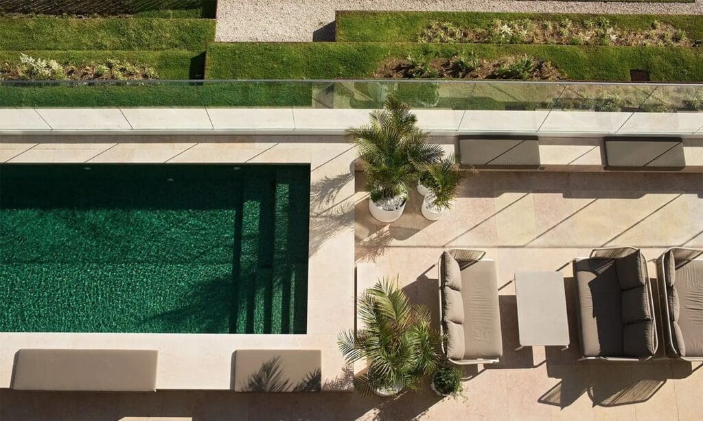 Infinity-style rooftop pool at Memmo Príncipe Real with panoramic Lisbon skyline views