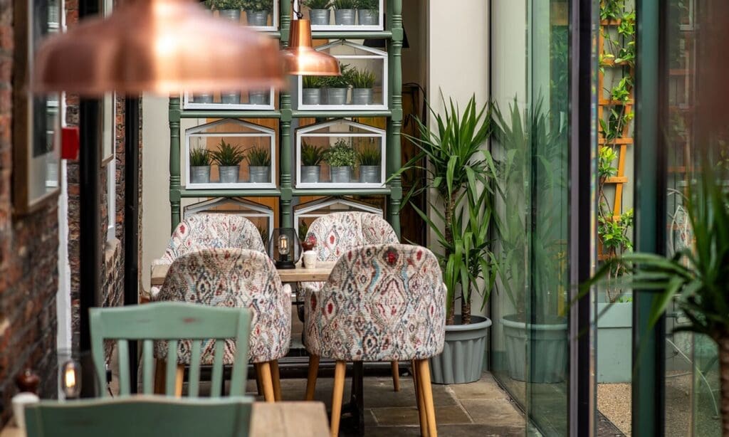 Sunny courtyard bar at Judge’s Lodging York — built-in pre-dinner drink spot for hens.