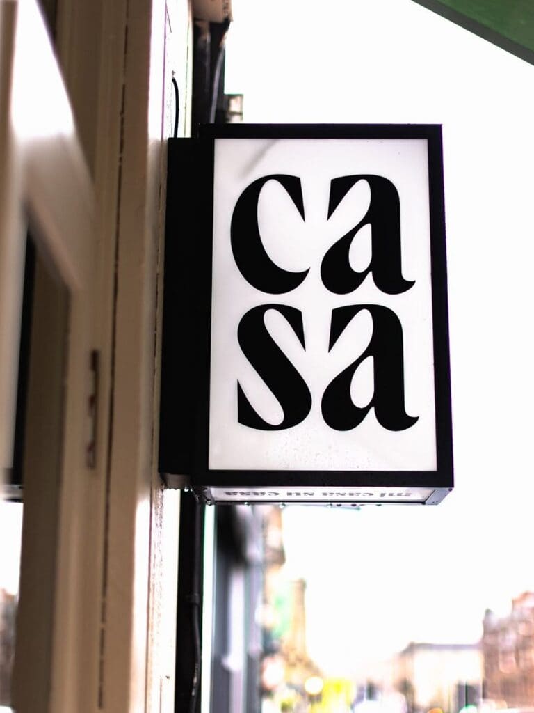 Hanging “casa” sign outside CASA in Glasgow’s West End, a cute stop for a hen weekend boozy brunch
