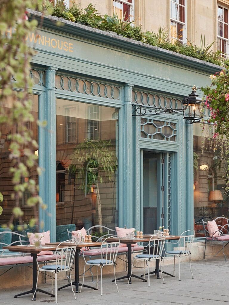Elegant brasserie-style dining room with high ceilings, polished tables and champagne-style brunch drinks set up for a hen weekend in Bath.