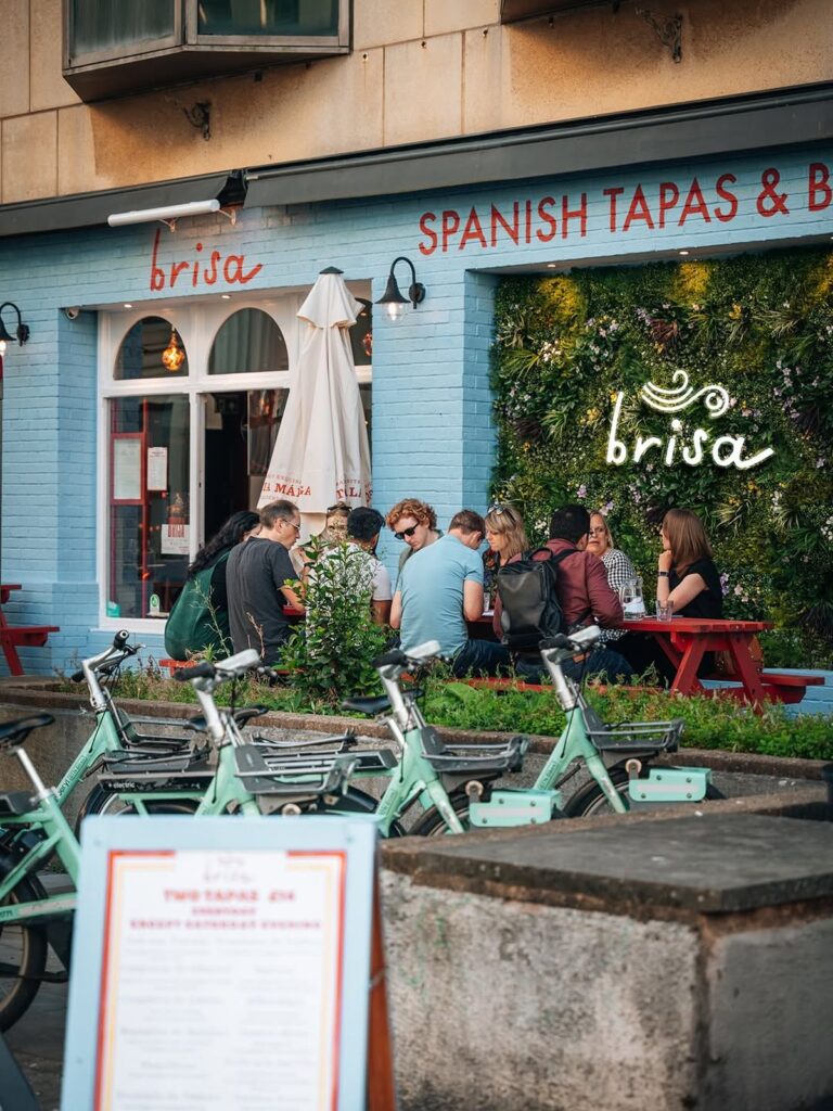 Exterior of Brisa Tapas with its entrance signage and terrace-style frontage in the Lanes, a Brighton hen weekend stop for small plates and wine.