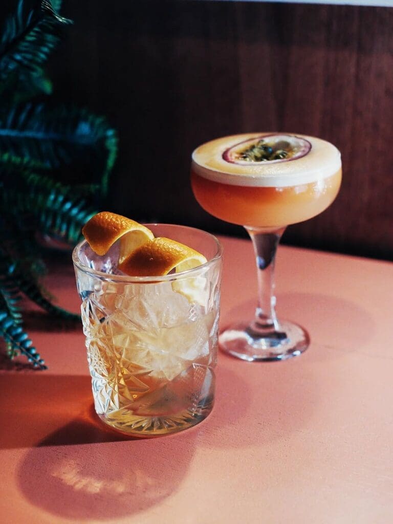 A French martini served at a lively bottomless brunch table during a Newcastle hen weekend.