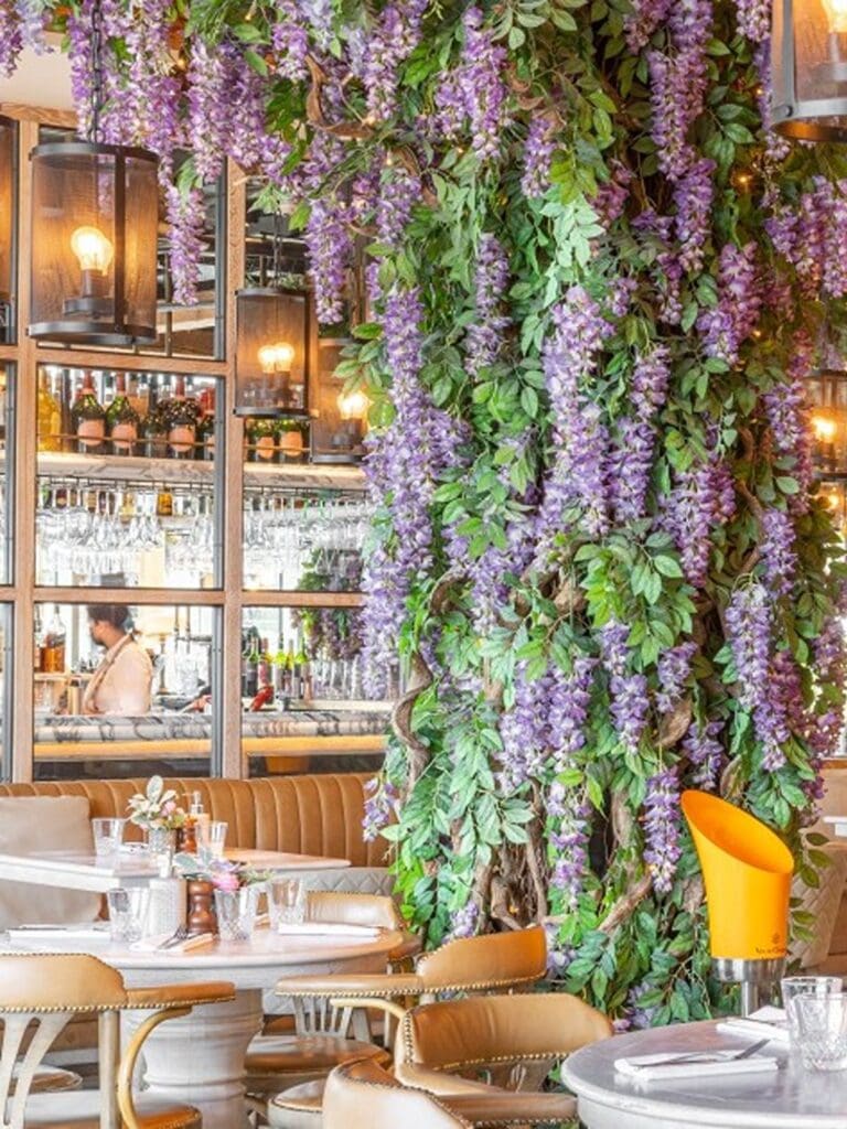 Wisteria-draped, glossy dining room at a Quayside restaurant with dressed-up brunch crowds for a Newcastle girls’ weekend.