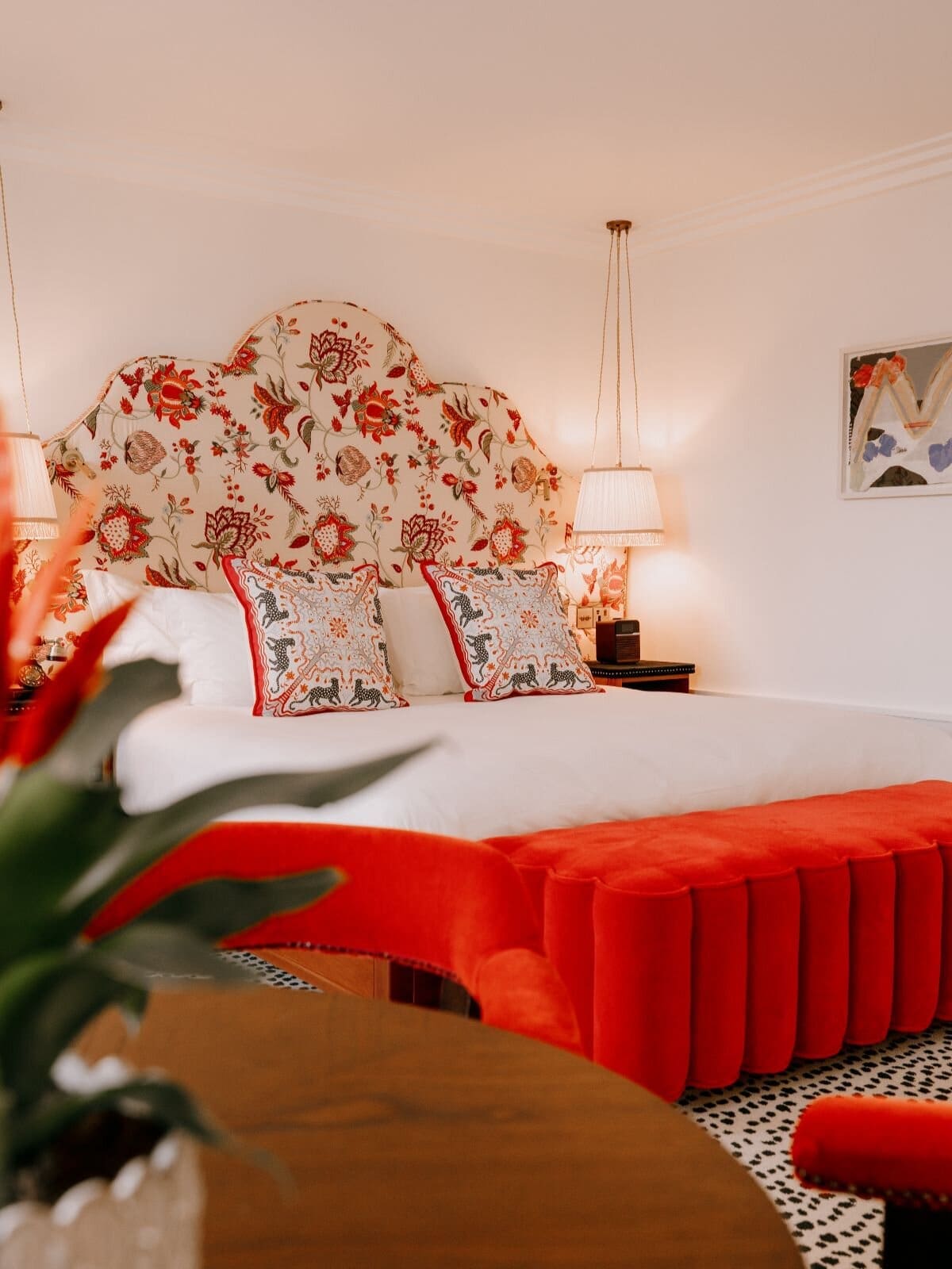 The Leinster Dublin hotel room with plush bedding, colourful decor and layered cushions.