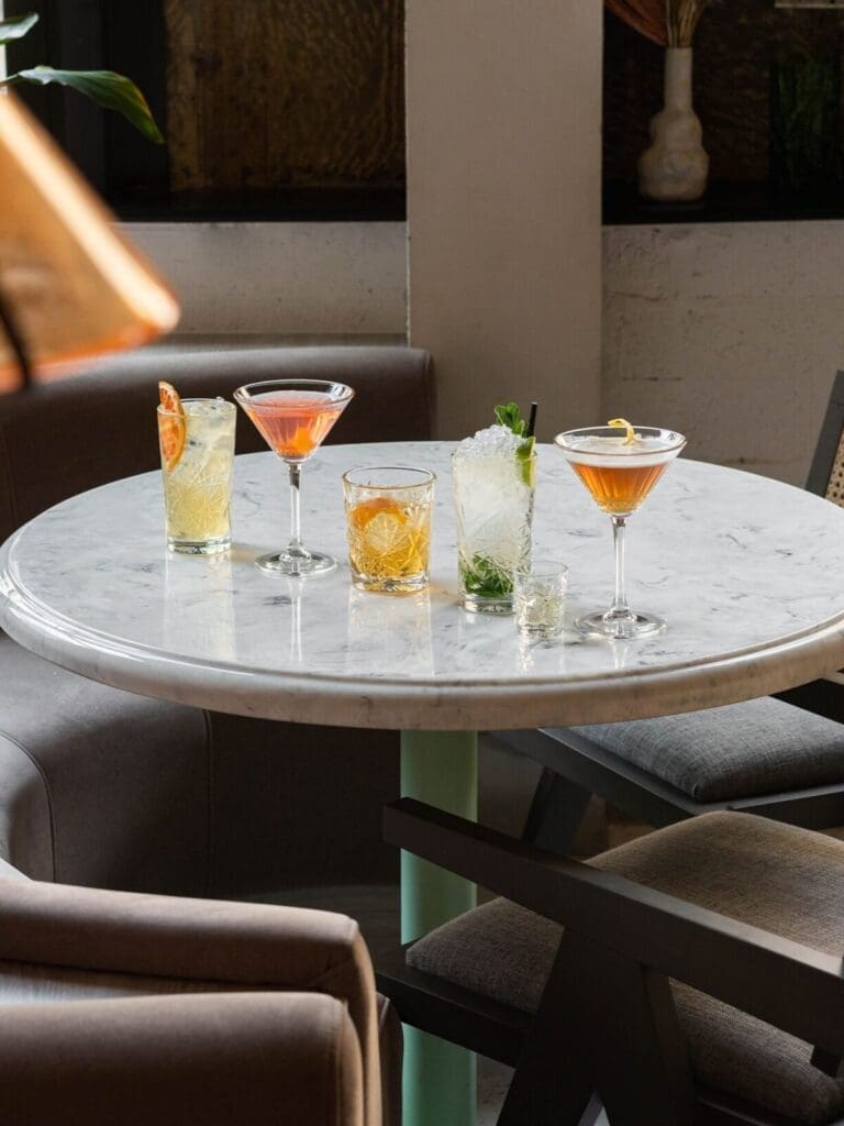 The Alan Manchester hotel lobby with open-plan seating and modern design, ideal for pre-drinks on a girls’ weekend
