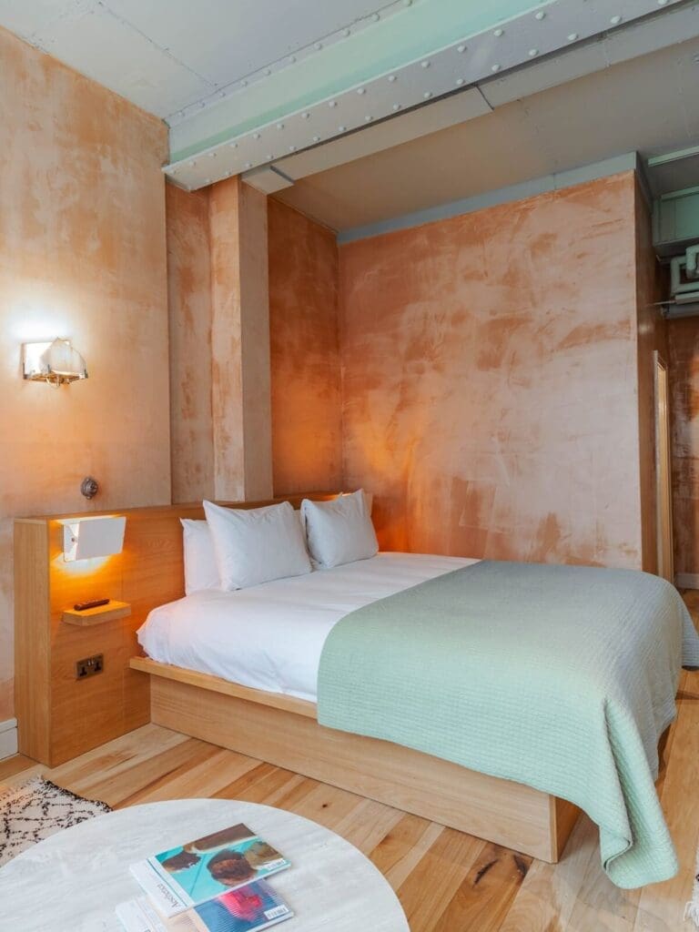 Studio room at The Alan Manchester with modern-industrial styling, sofa seating and soft neutral tones