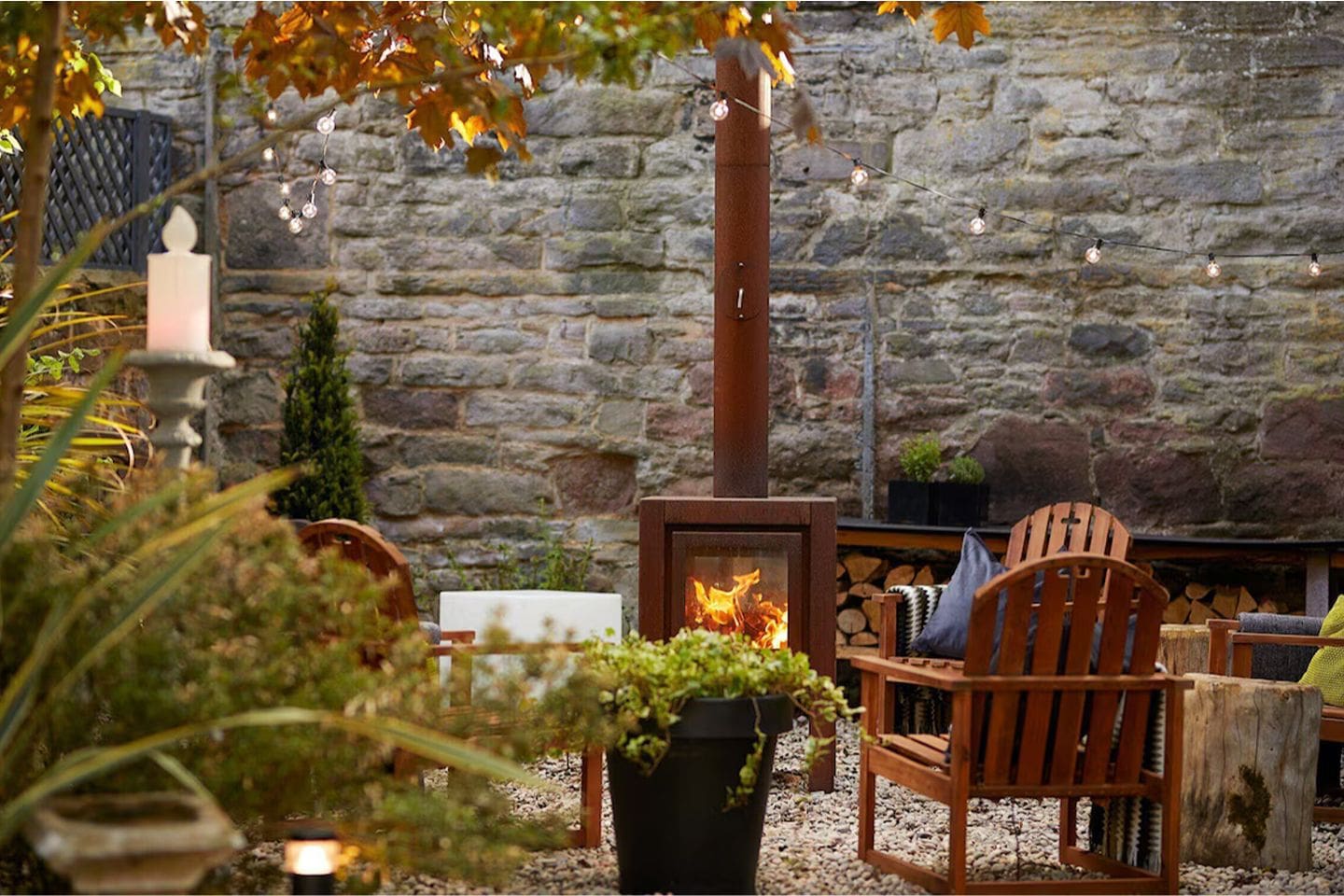 Private garden at 94DR Edinburgh townhouse with outdoor seating, fire pit and string lights, ideal for a cosy hen weekend stay