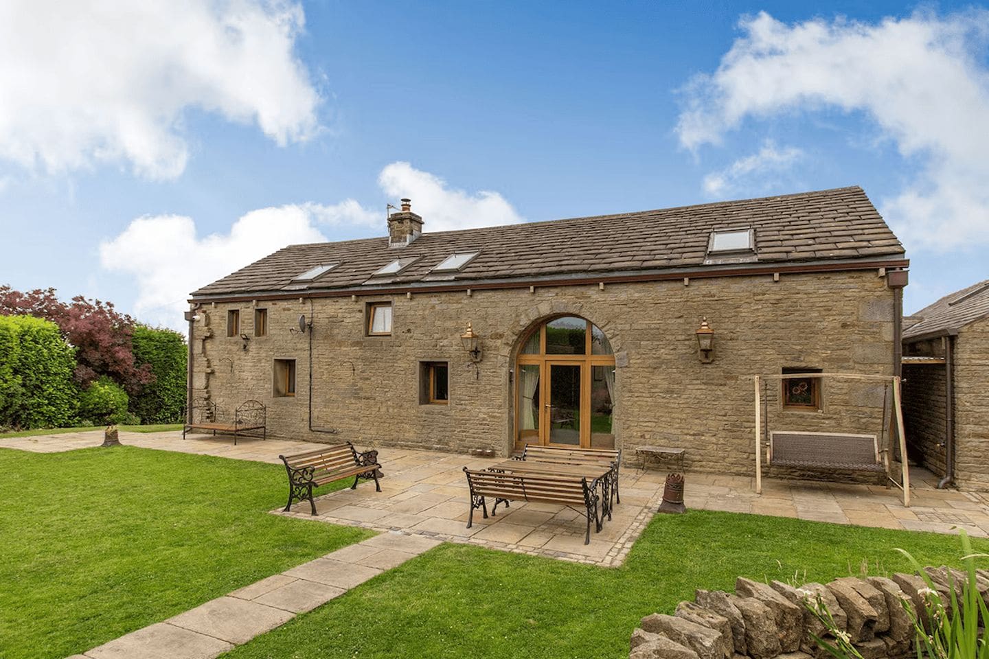 Rustic barn conversion near Manchester with woodburner and cosy interiors, perfect for a relaxed hen weekend escape.