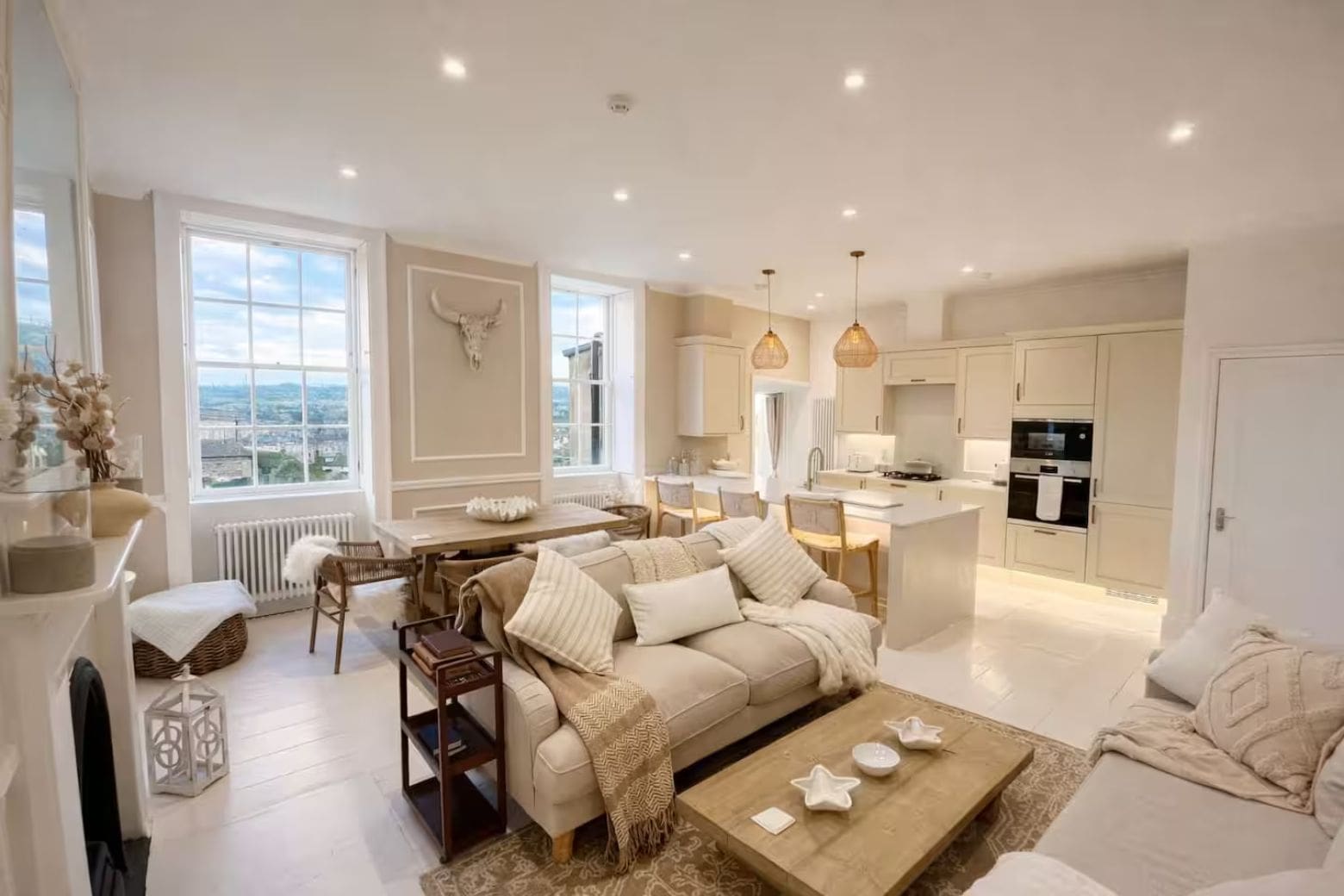 Elegant Georgian interiors with soft neutral tones and high ceilings in Airbnbs in Bath for a hen weekend.
