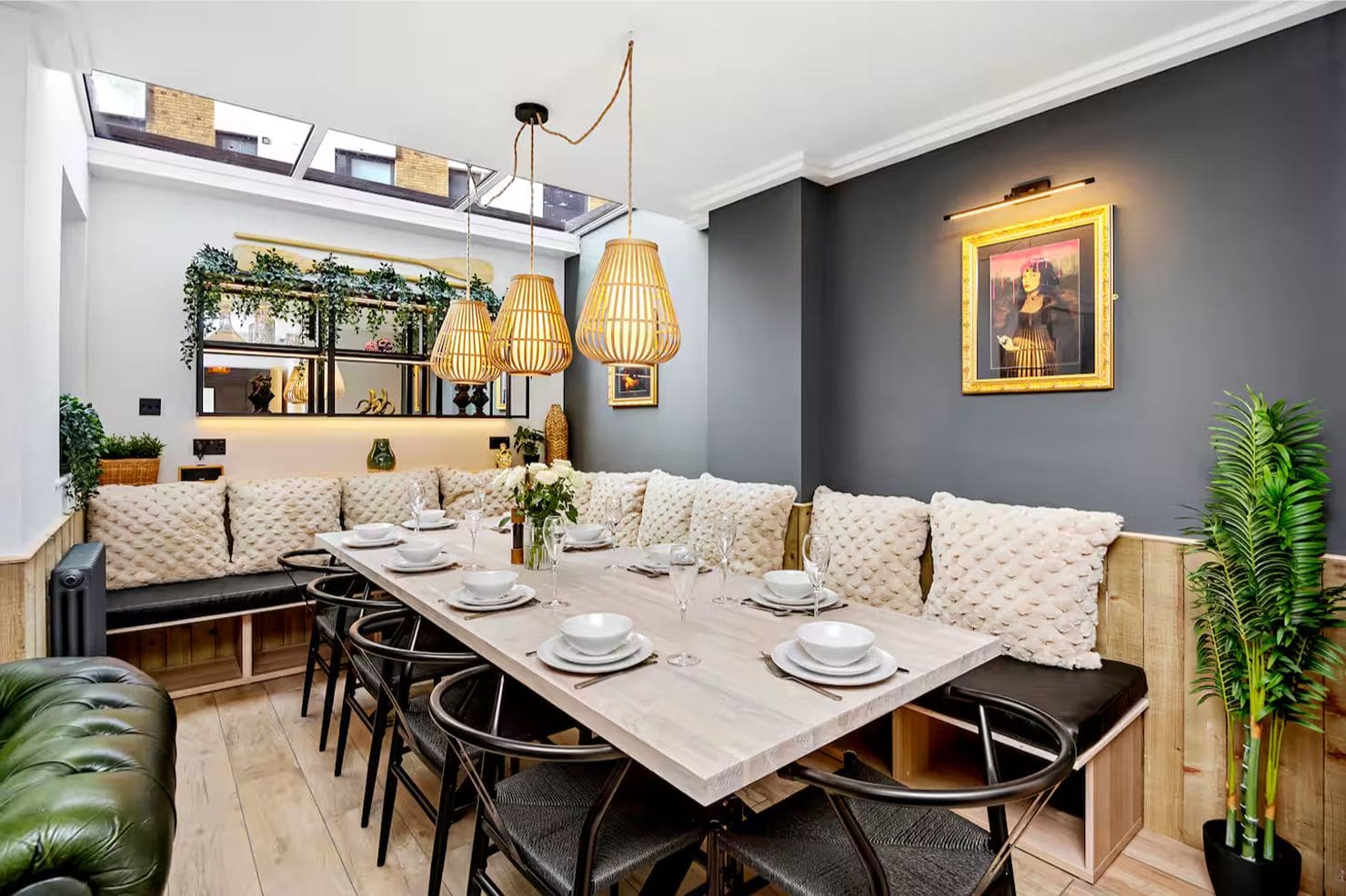 Open-plan dining area in Driftwood House Brighton with long table and bench seating, perfect for hen weekend group stays