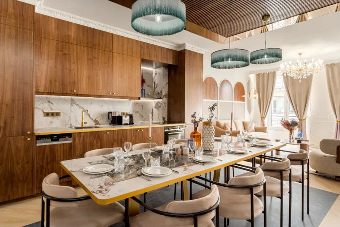 Luxury Paris apartment dining area with marble table and wood kitchen, plus soft-toned bedroom with arched headboard and natural light