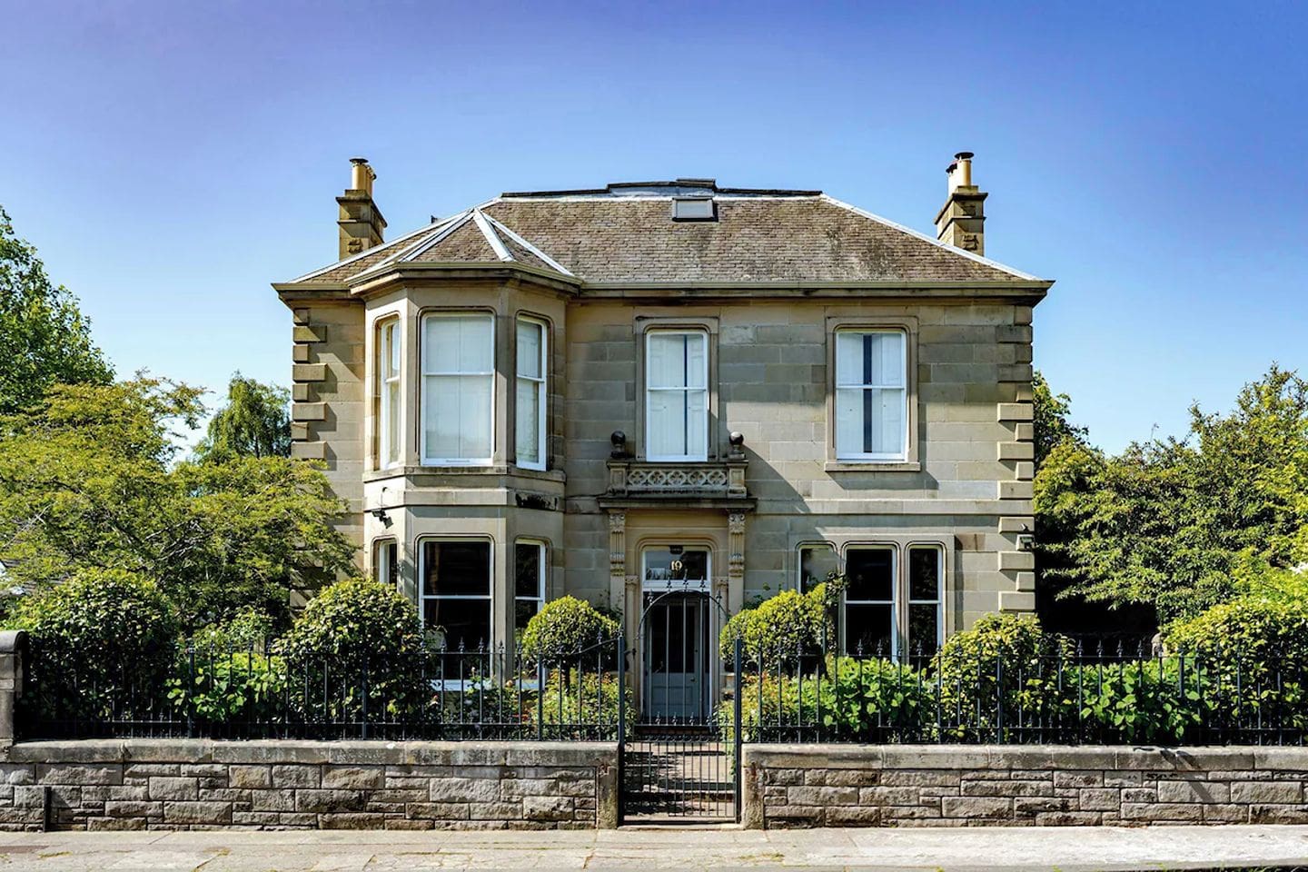 Large detached house in Ravelston Edinburgh with private garden and classic stone exterior, ideal for a peaceful group stay