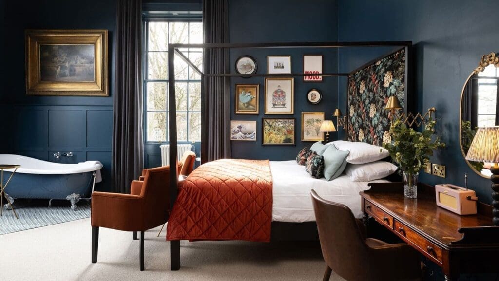 Four-poster bed and in-room bathtub at The Churchill York — dreamy hen weekend sleepover vibes