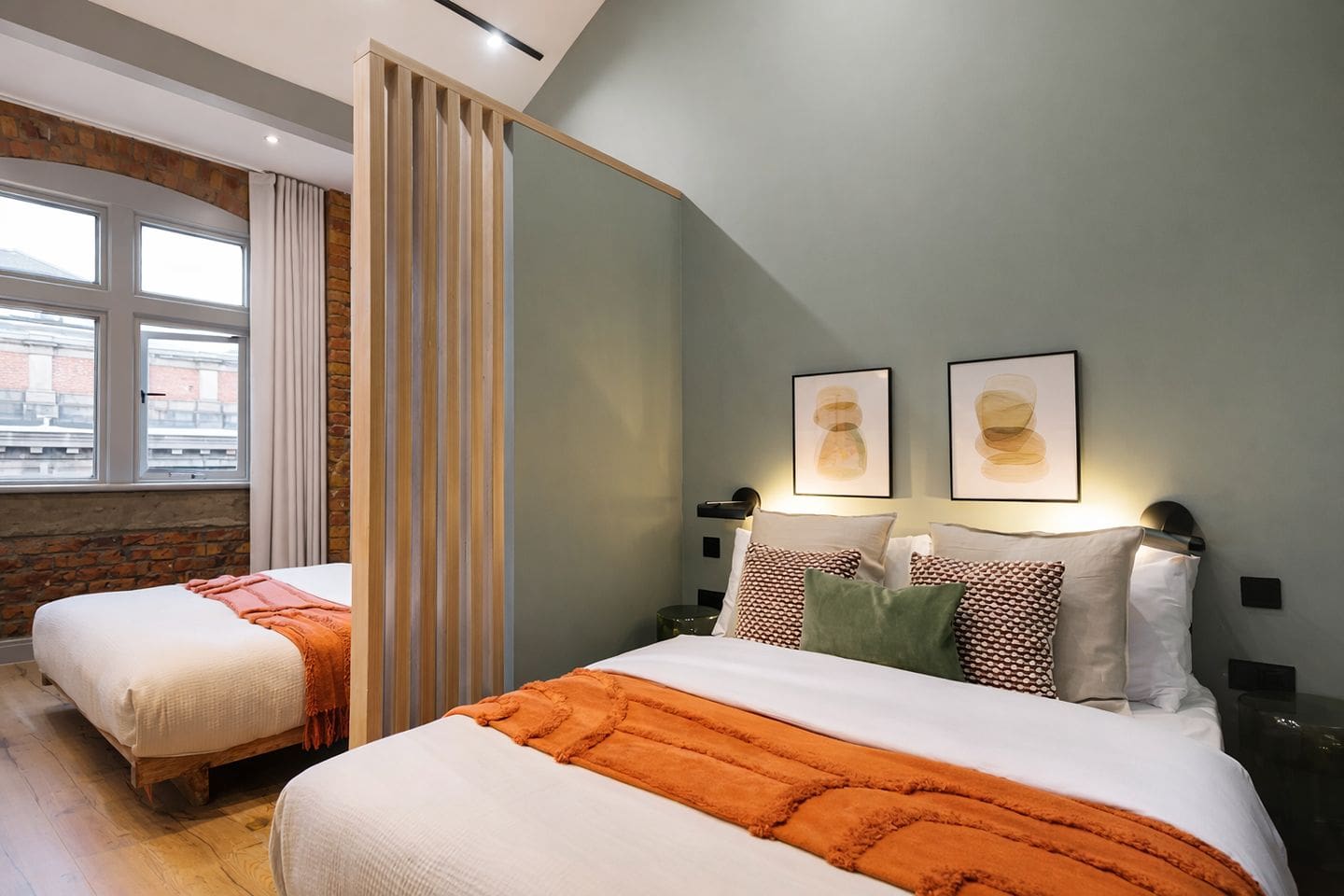 Open-plan living and dining space in a Manchester penthouse Airbnb, ideal for hen weekends with drinks flowing and everyone together.