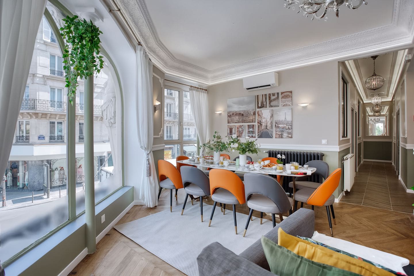 Colourful Haussmann apartment in central Paris with spacious living room, high ceilings and modern interiors for hen weekends in Paris