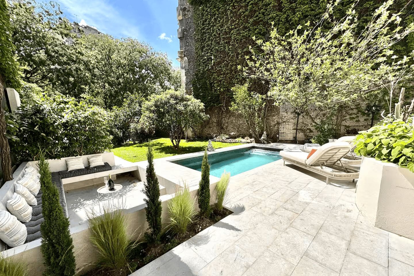 Paris villa with private heated pool and garden terrace, alongside bright glass dining room and spacious interiors designed for Paris hen weekends