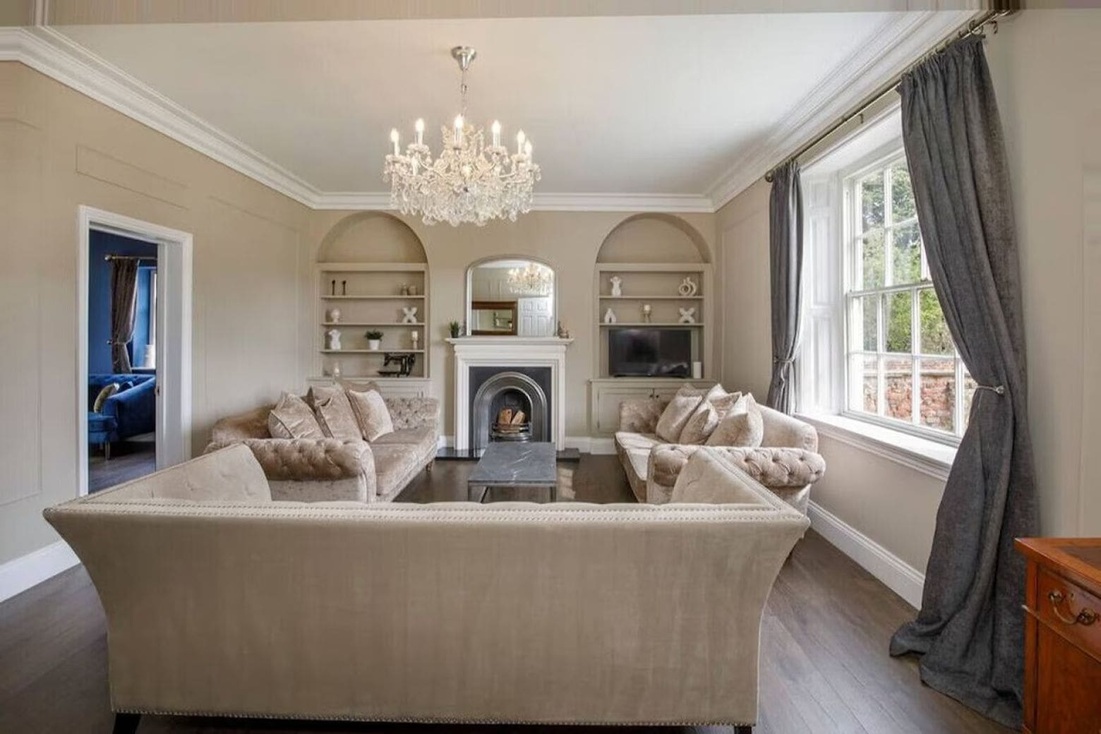 Large kitchen with island and outdoor terrace with pizza oven in Airbnbs in York for a hen weekend in a peaceful village.