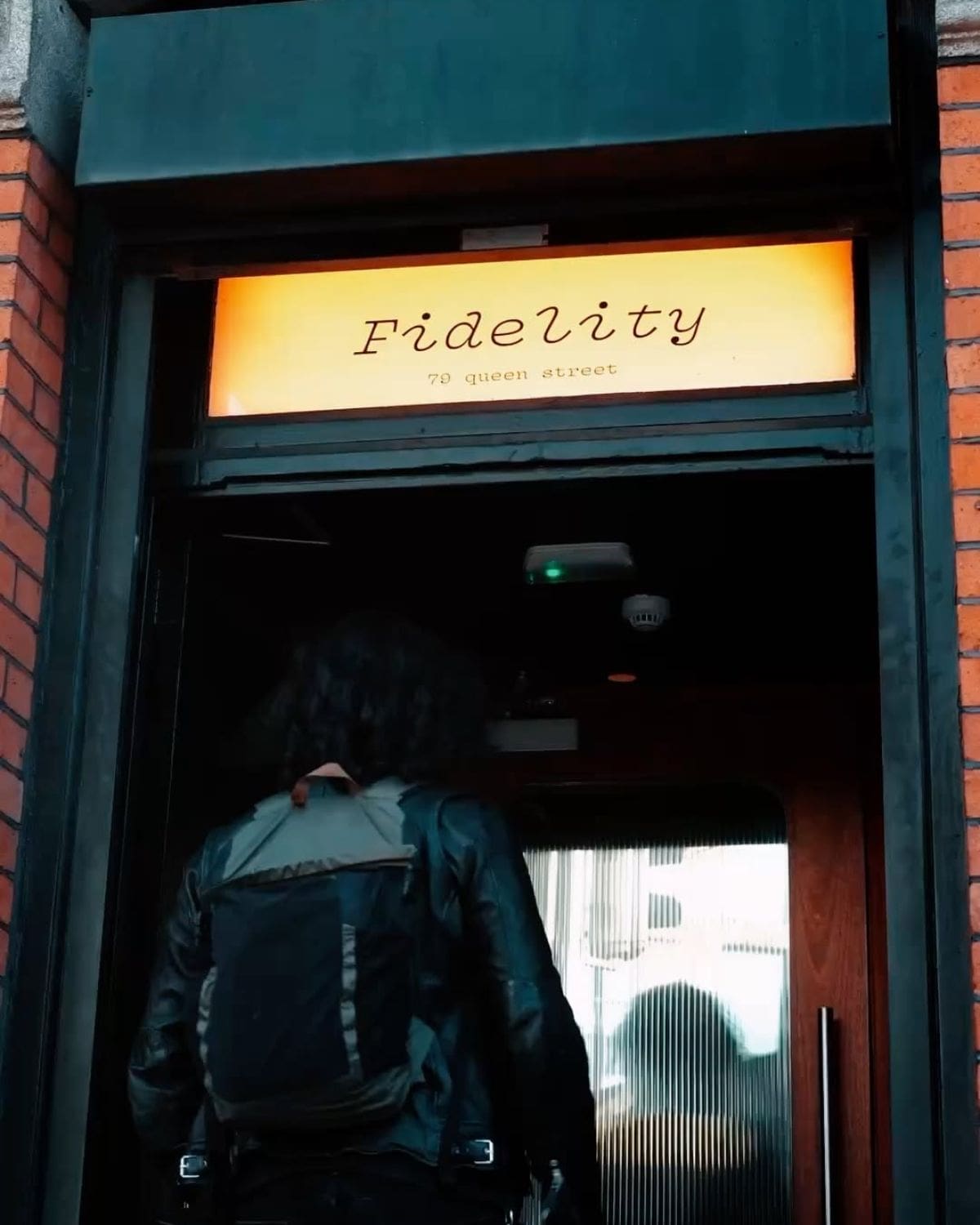 Glowing Fidelity sign above the entrance to the Dublin bar, with a low-lit doorway and cool, understated feel for a girls’ night out in Dublin.