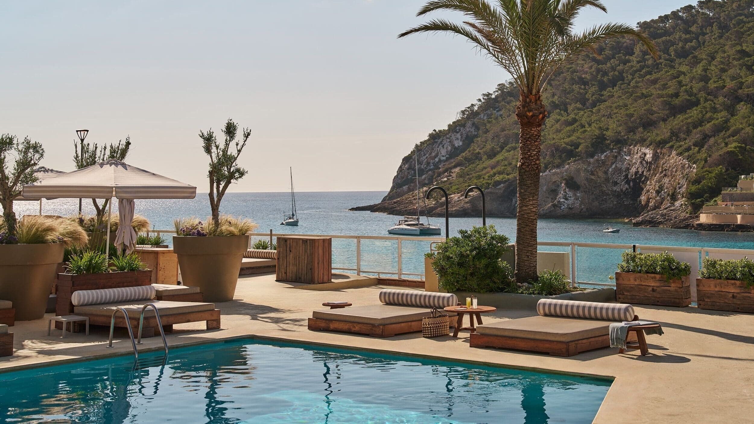 Hyde Ibiza pool with calm Balearic decor, crisp bedding and private terrace doors.