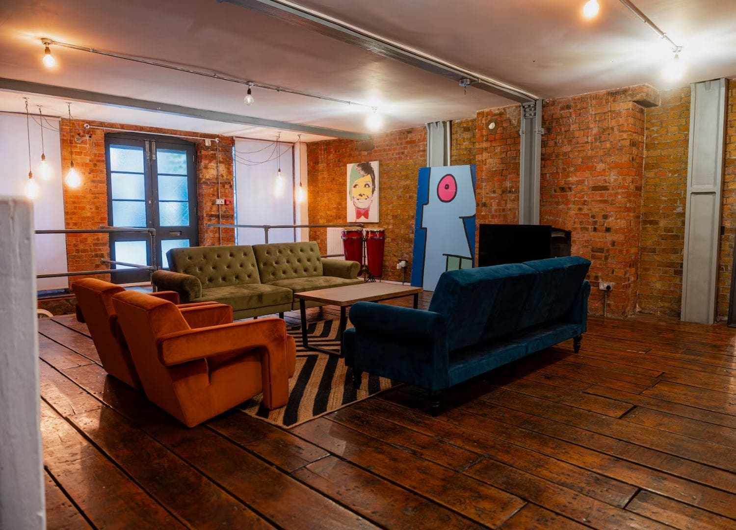 Warehouse-style loft with open-plan sleeping spaces and lively Shoreditch setting in Airbnbs in London for a hen weekend.