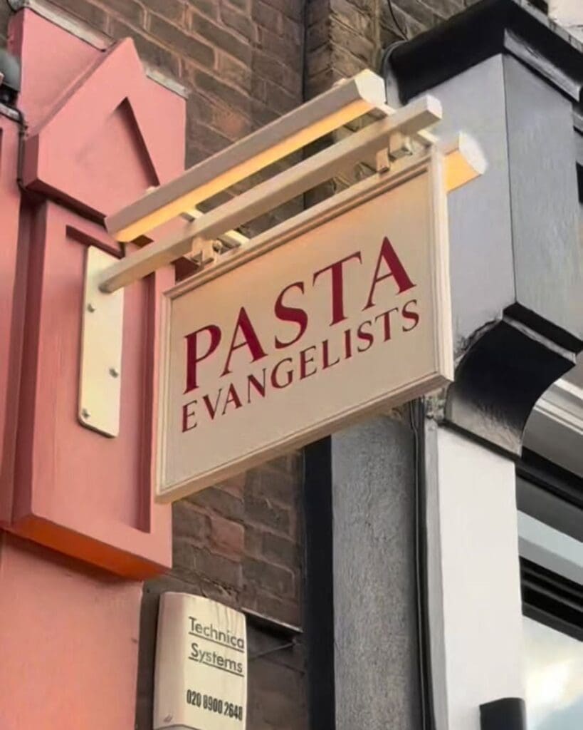 Pasta Evangelists sign outside a London venue, featured as a pasta-making class option for London hen activities and a relaxed hen weekend plan.