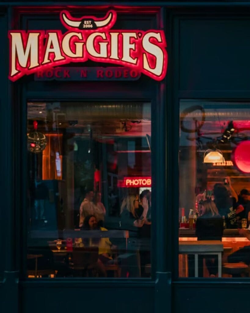 Country-themed party atmosphere at Maggie’s Rock ’n’ Rodeo in Glasgow, a high-energy spot for music, dancing and hen weekends.