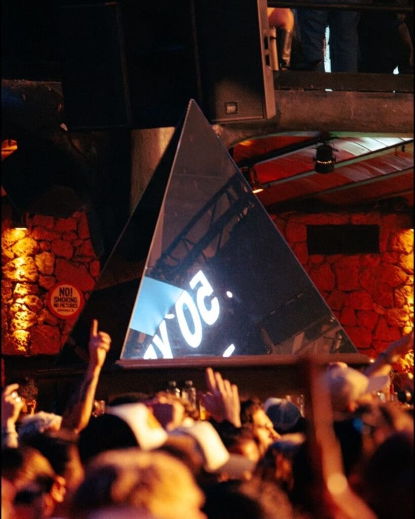 Packed club atmosphere at Amnesia in Ibiza, a legendary late-night venue for dancing until sunrise on a hen weekend.