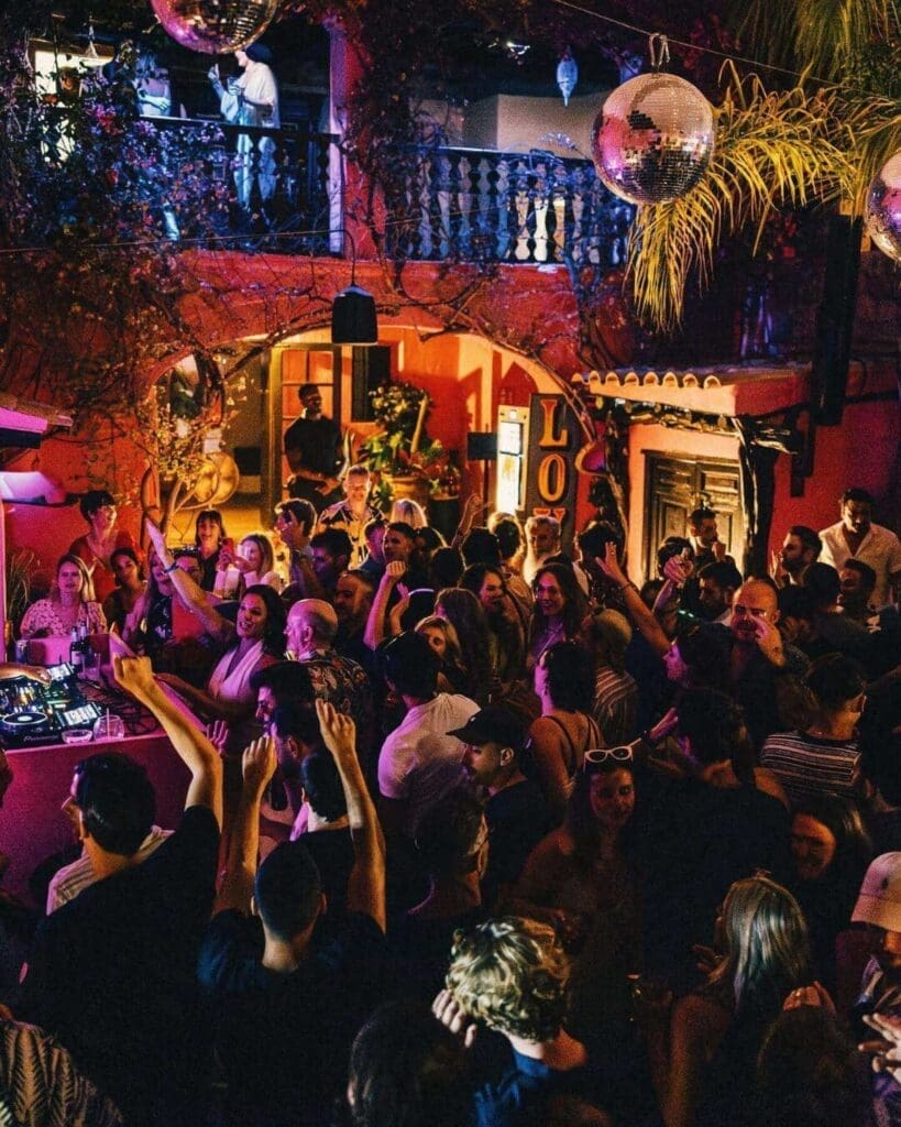 Late-night party atmosphere at Pikes in Ibiza, a cult hotel and club spot for dancing, cocktails and a memorable hen weekend night out.