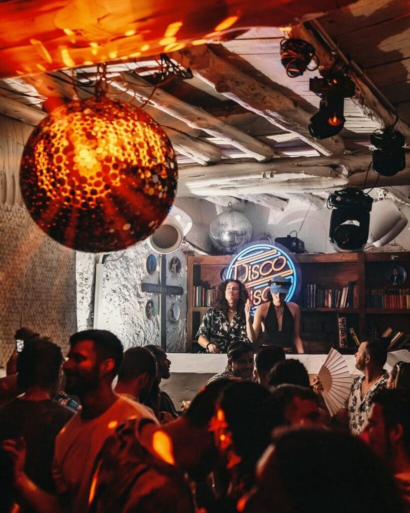 Late-night party atmosphere at Pikes in Ibiza, a cult hotel and club spot for dancing, cocktails and a memorable hen weekend night out.