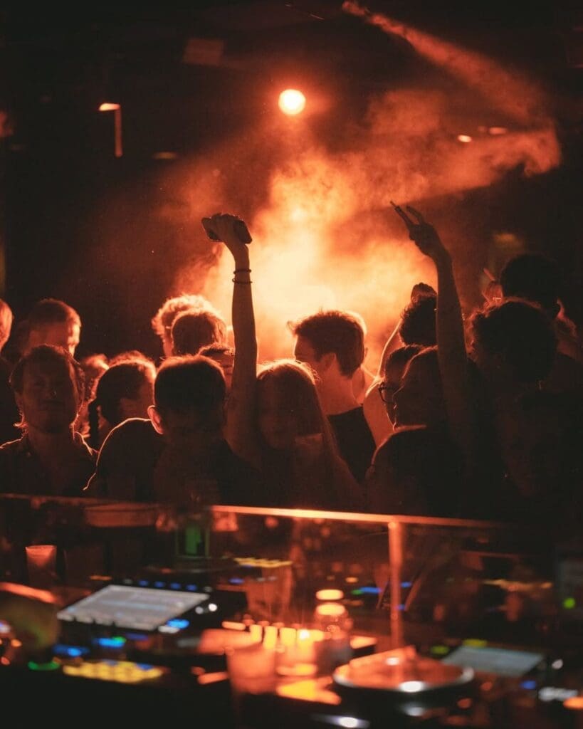 Open-air party atmosphere at Urban Beach Lisboa, a late-night club spot for dancing on a girls’ trip or Lisbon hen weekend.