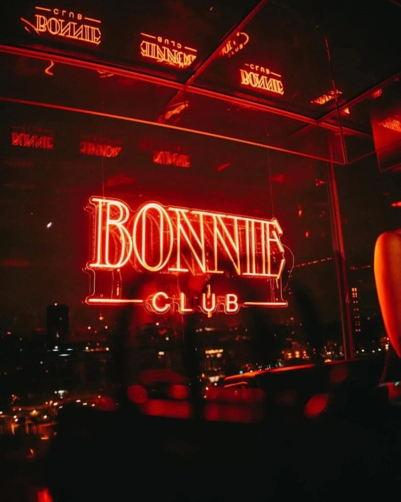 Stylish rooftop bar and club atmosphere at Bonnie Paris, a glamorous choice for cocktails, skyline views and a dressed-up hen weekend night out.