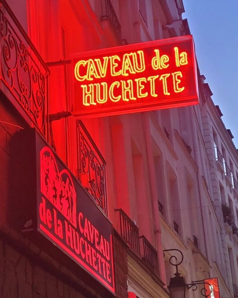 Late-night jazz club atmosphere at Caveau de la Huchette in Paris, a lively spot for music, dancing and a memorable hen weekend night out.