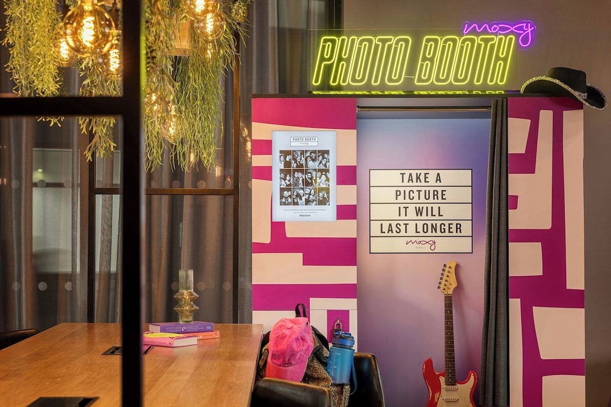 Photo booth at Moxy Glasgow Merchant City, a fun Glasgow hen weekend hotel with playful interiors and quirky spaces for group photos.