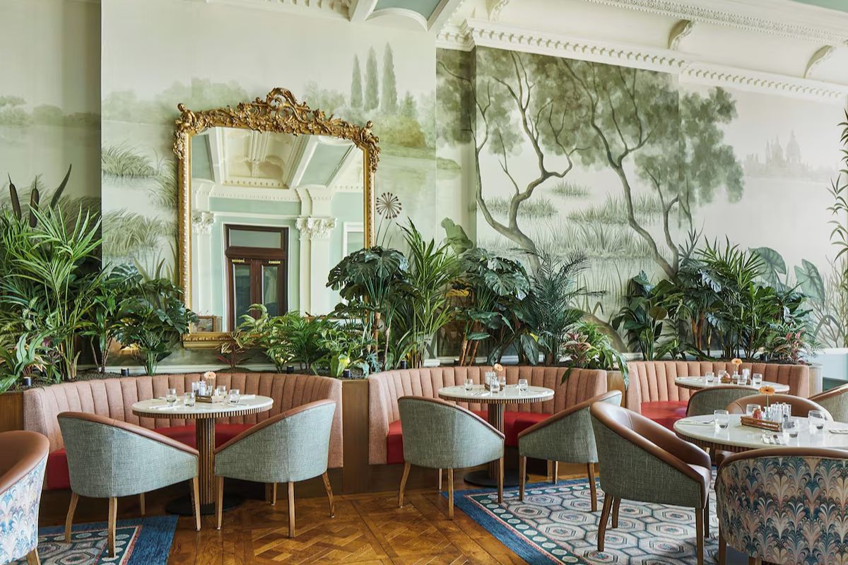Elegant restaurant at The Grand Brighton, a luxury Brighton hen weekend hotel with botanical interiors, soft pink seating and statement décor.