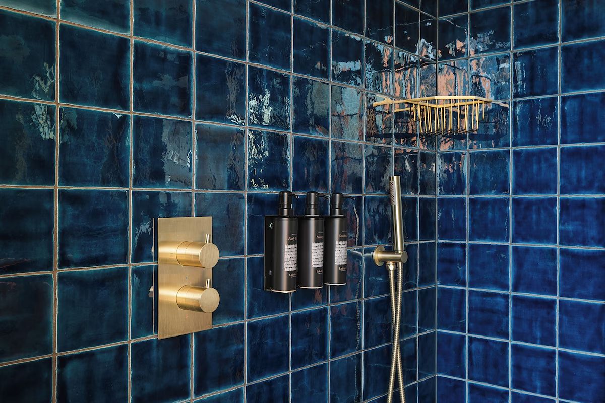 Blue tiled shower at The Dean Docklands, part of the modern bathrooms in this Dublin hen weekend hotel.
