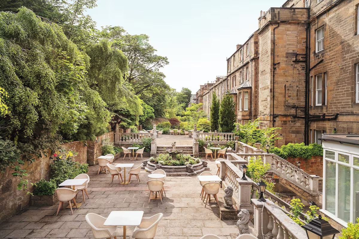 Garden terrace at voco Edinburgh – Royal Terrace, an Edinburgh hen weekend hotel with outdoor seating, greenery and a peaceful city-centre setting.