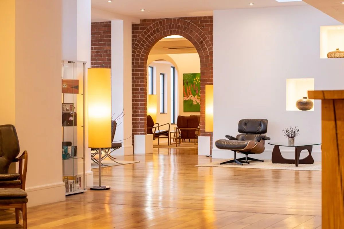 Lobby at Hope Street Hotel with exposed brick and warm contemporary interiors.